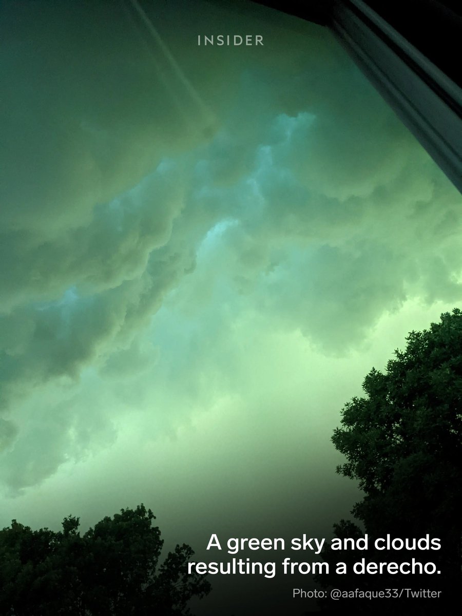 Photo shows a green sky and clouds resulting from a derecho.