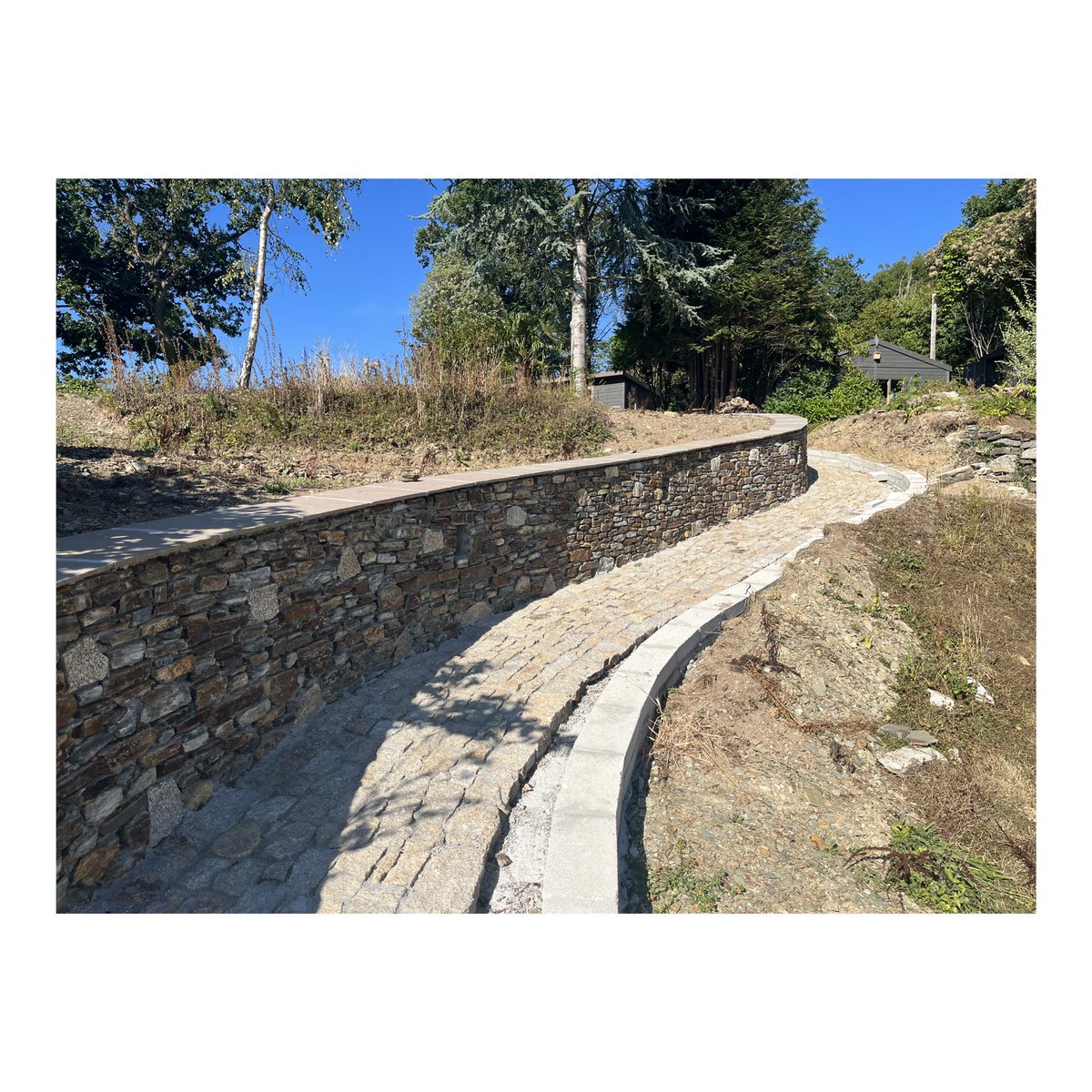 BissellClaire's tweet photo. New granite setts garden path going in on one of my #devon projects. Looking forward to seeing this planted up next year with a #prairieplanting scheme. #gardendesign #architecture https://t.co/bJqlbWbKji