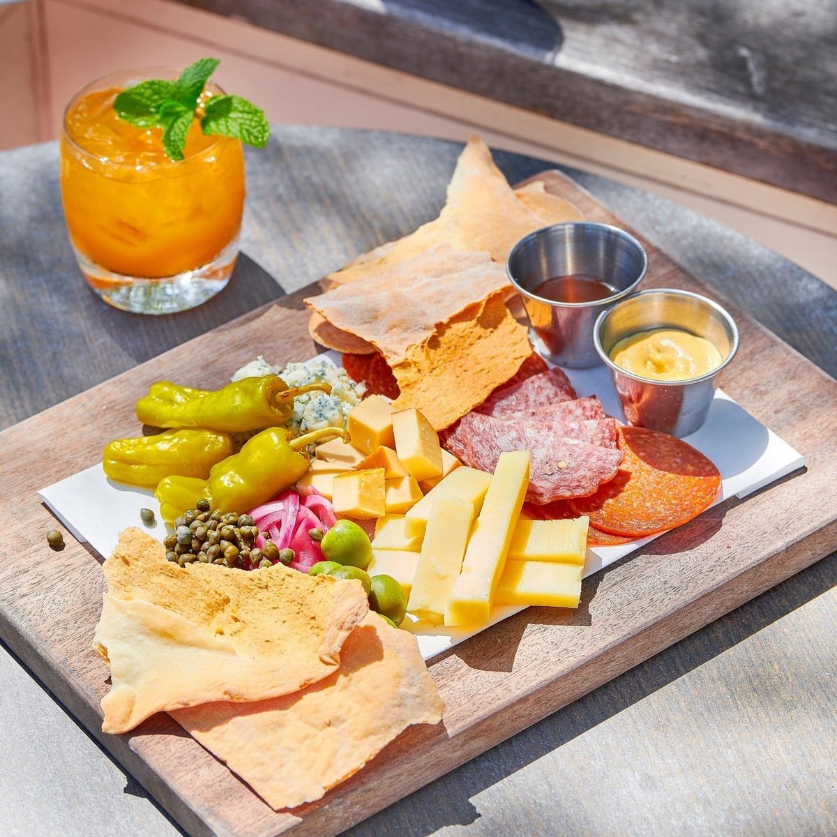 @livingfoodshawaii charcuterie board made up of house-cured meats, fine cheeses, local honey and lavash crackers. Now that's a snack we can get behind. [repost]