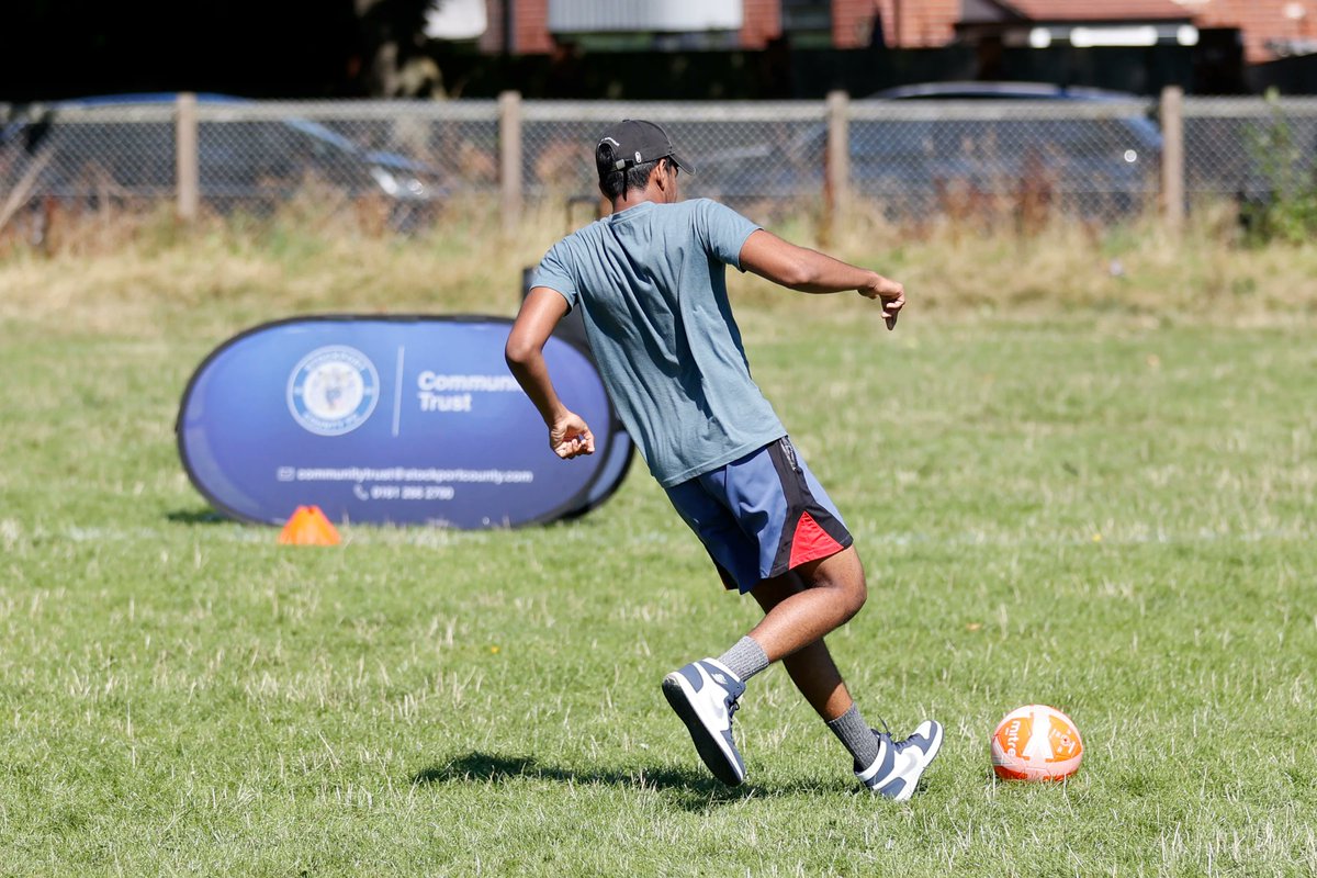 StockportCounty's tweet photo. Our @SCFCCommunity team are providing weekly football sessions for asylum seekers in Stockport. 

The sessions aim to improve mental health whilst providing fun for all participants! They donated some training kit for the players today, along with bringing the Trophy along! ⚽️ https://t.co/GFyeVyglQi