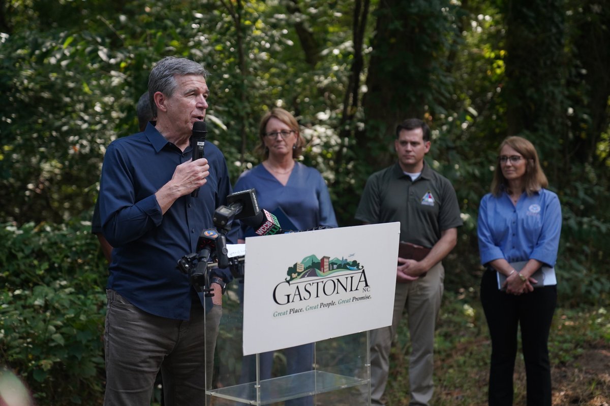 NC_Governor's tweet photo. Today, Gov. Cooper joined @FEMA_Deanne and other officials in Gaston County to announce $3.1 billion in resiliency funding through FEMA grants. Duharts Creek will receive a grant to help reduce flood risk and improve public safety, making the community more resilient. https://t.co/ss42cXyLQh