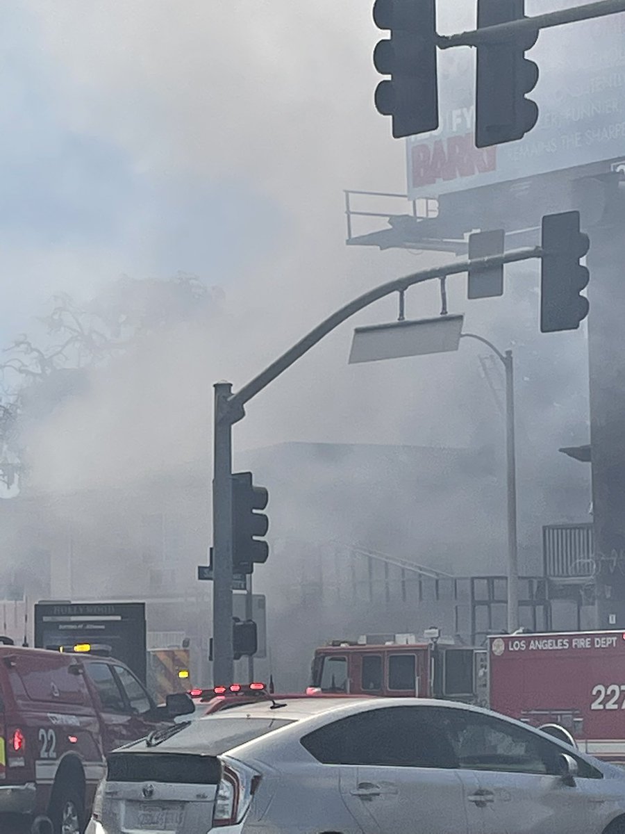 Same theater that burned a month back at Hollywood Blvd and Las Palmas is burning again, with people trapped in adjacent motel: