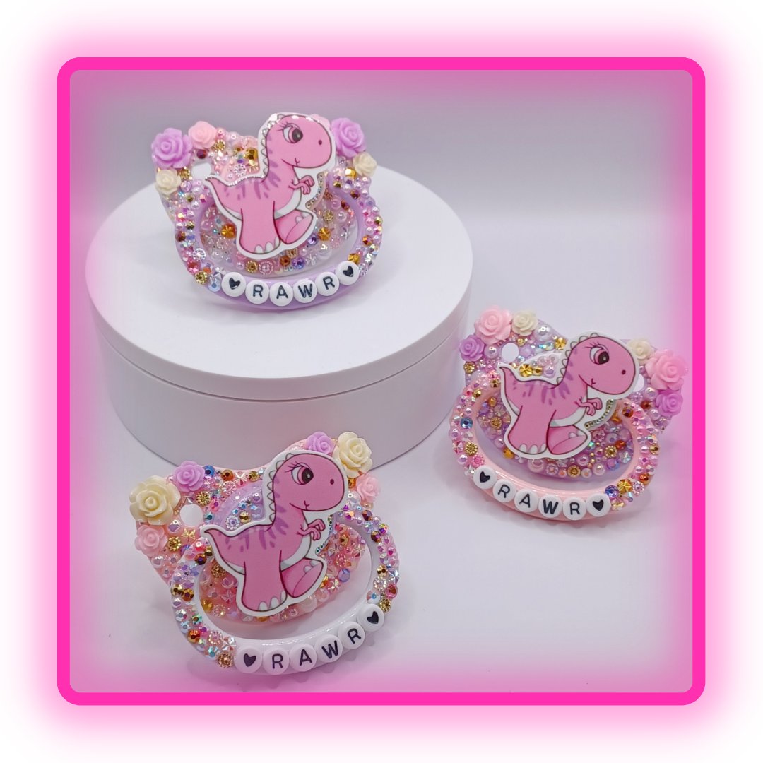 LittleShop89's tweet photo. This beautiful Pacifier has a pink, purple, white and gold rhinestone and pearl mix with beautiful roses and the wording Rawr on the handle.   #adultpacifer #adultpacifiershop #decopaci #adultpaci #adultpacifierstore #smallbiz #decoadultpacifier #littlespace #kidre #noncom https://t.co/TUhgpxhWVC