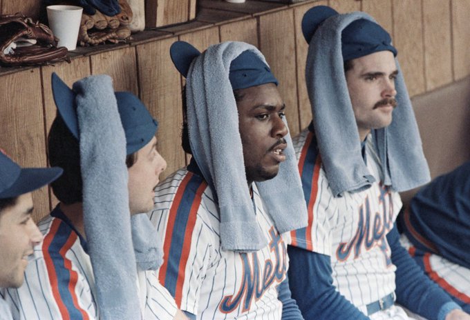 Mets in the dugouts with their rally caps on, 1986