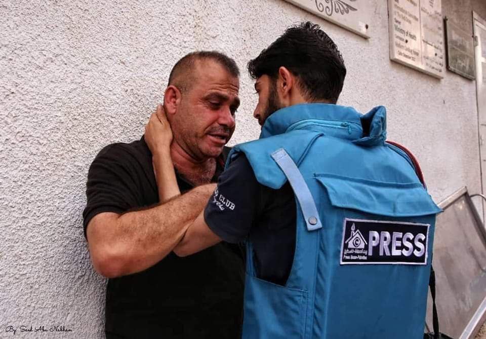 wasim_DM's tweet photo. Journalism in Gaza is not just a profession!

Palestinian journalist Samer Al-Zaanin comforts the uncle of Nour Zweidi, who was murdered in an Israeli airstrike on Gaza during the last aggression. Shame on you Israel https://t.co/LOUDeqVHfl
