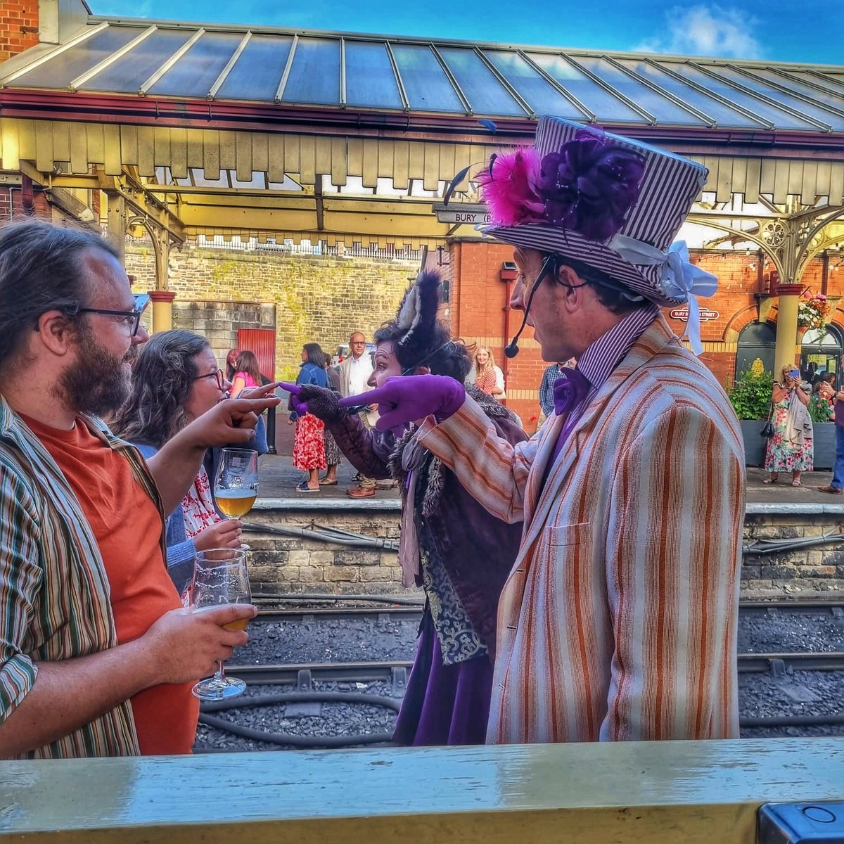The Mad Hatter and March Hare greet guests at <a href="/eastlancsrly/">East Lancashire Railway</a> ...At least we think that's what they're doing? 😅