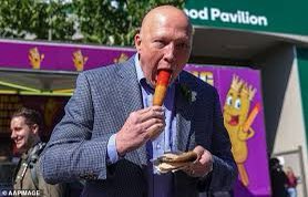 WorkingClassDan's tweet image. What sort of nonce figures he doesn’t want to look stupid eating a Dagwood dog sideways and still goes ahead and orders a Dagwood dog knowing full well the photos that will be taken?