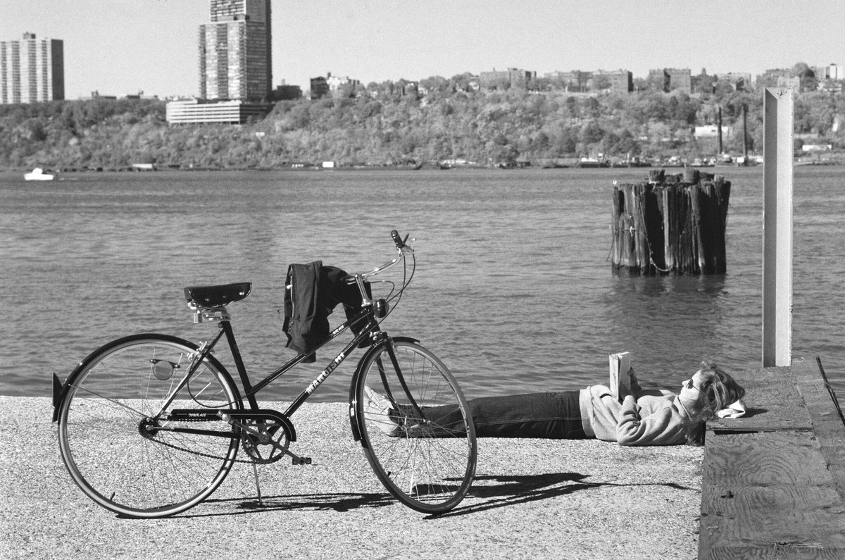Even in the busiest of places, if you have a good book, you can retreat into solitude. Old photos from <a href="/nytimes/">The New York Times</a> in New York City.