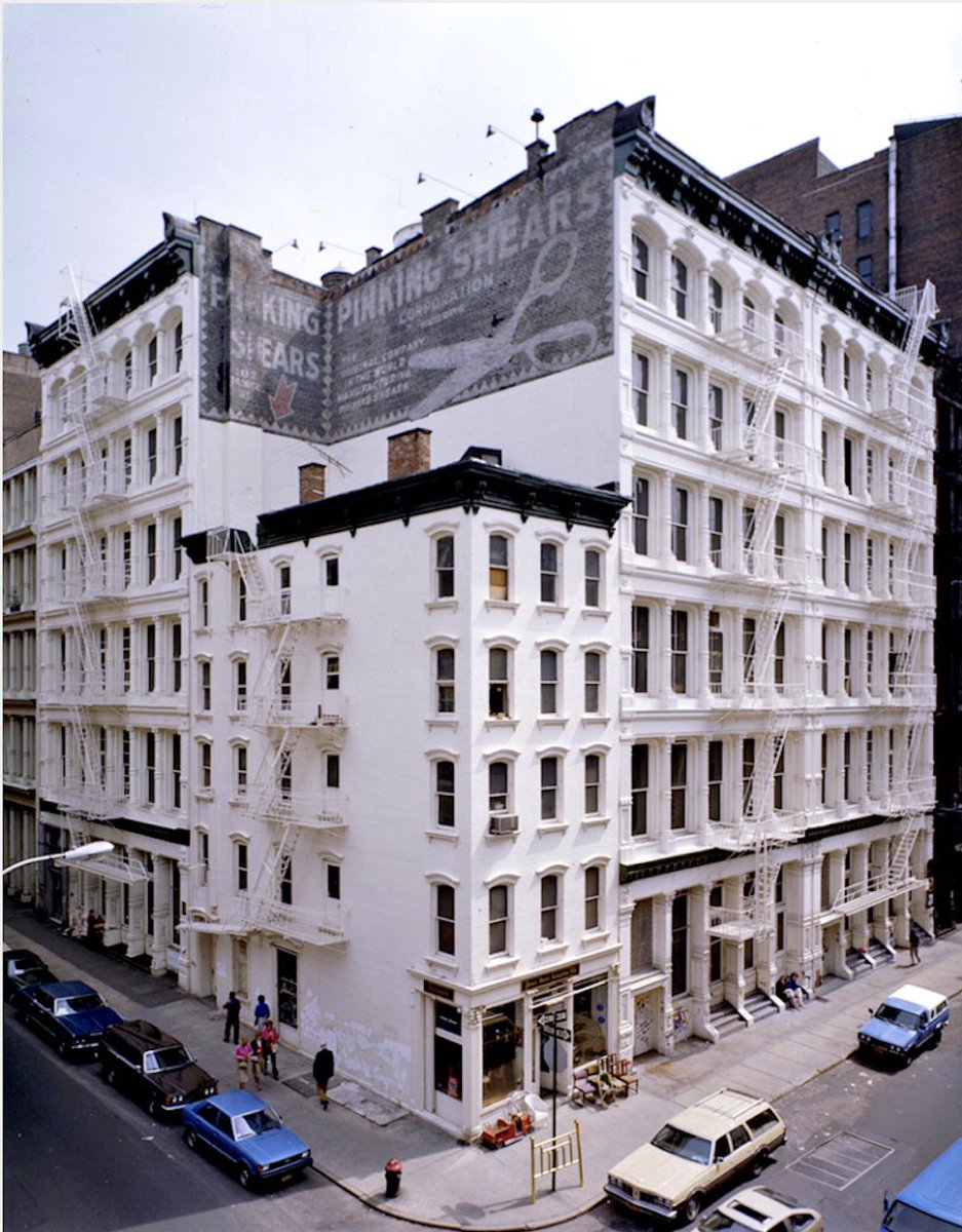 sohomemory's tweet photo. All white! Southeast corner of Prince and Greene in the 1970s (photo: Gil Amiga). I love the ad for the pinking shears up above. #SoHomemory https://t.co/AIpW8aU9vN