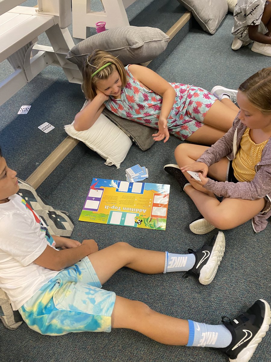 Practicing cooperation and reviewing math skills with partner games this morning!