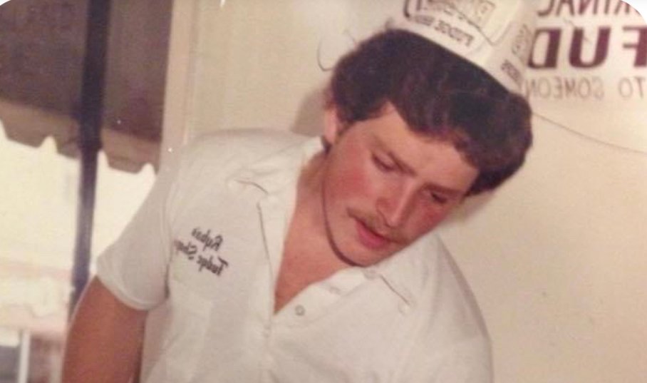 rybasfudge's tweet photo. 70s Throwback 🪩 If you thought we were going to miss the chance to share this gem, you'd be trippin'.  Former fudge maker and longtime family friend Doug Corey is sporting some groovy hair under his paper cap in this throwback to the late 70s. 
#hairgoals #TBT https://t.co/PqBOvOBCM3