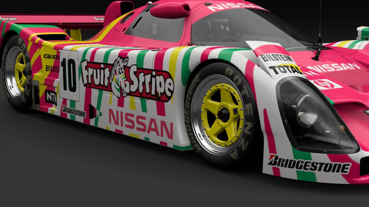 chrissiegle's tweet photo. The last of the wedge-shaped GR1 cars from the late 80s/early 90s. My Nissan R92CP, sponsored by Fruit Stripe gum. #GranTurismo7 #GT7Livery #LiveryEditor https://t.co/2EmqW9WMBK