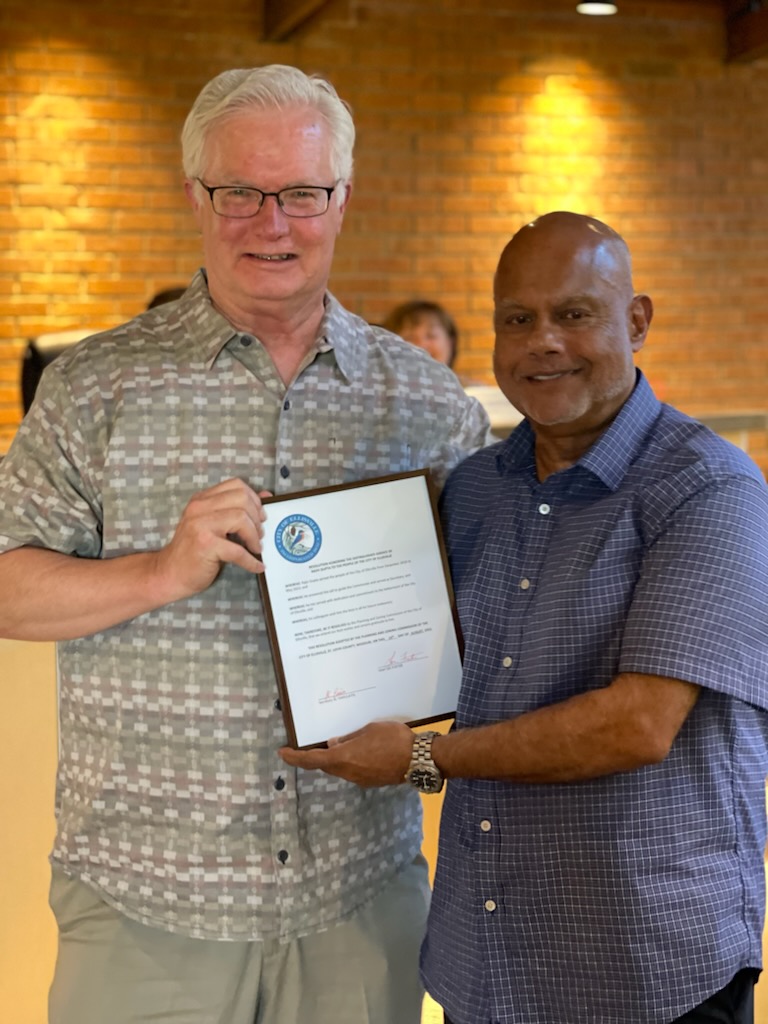 Chairman Lee Foster presents resolution to former Planning and Zoning member Rajiv Gupta for his service to the City.