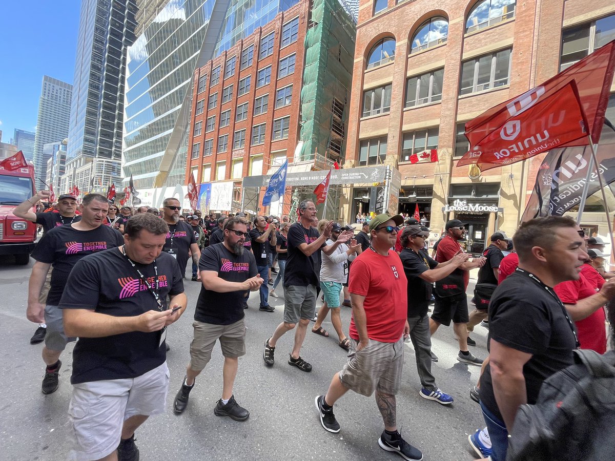 UniforTheUnion's tweet photo. HAPPENING NOW: Unifor marches in downtown Toronto to show solidarity with striking workers at the Ash Grove cement plant in Quebec. The workers have been locked out for nearly 15 months now over wages, flexibility and outsourcing. https://t.co/Vz4UplBCYw