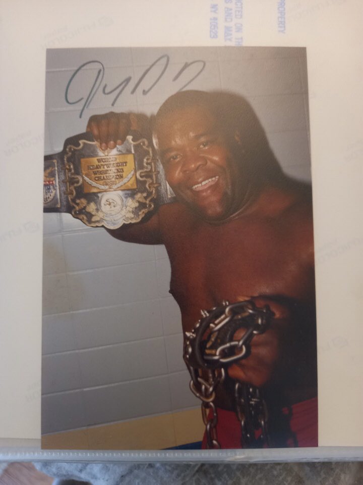 OfMarksAndMen's tweet photo. Killing time while we wait for the interns to finish editing the new episode. We’ve got some stellar collections here at OMAM, check out @jdreager ‘s USWA merch table photo from the Mid-South Fair of the one and only JYD! New episode drops tomorrow. THUMP! https://t.co/GffvfGnAm3