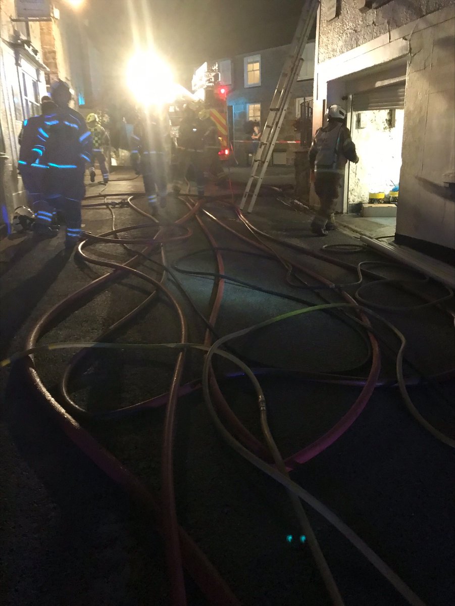 Incident Commander's.  A 0045hr arrival in a small but popular holiday town in peak season. Multiple premises of various purpose groups in front of you.  Smoke issuing from roof space across a terrace.  Give me your plan....