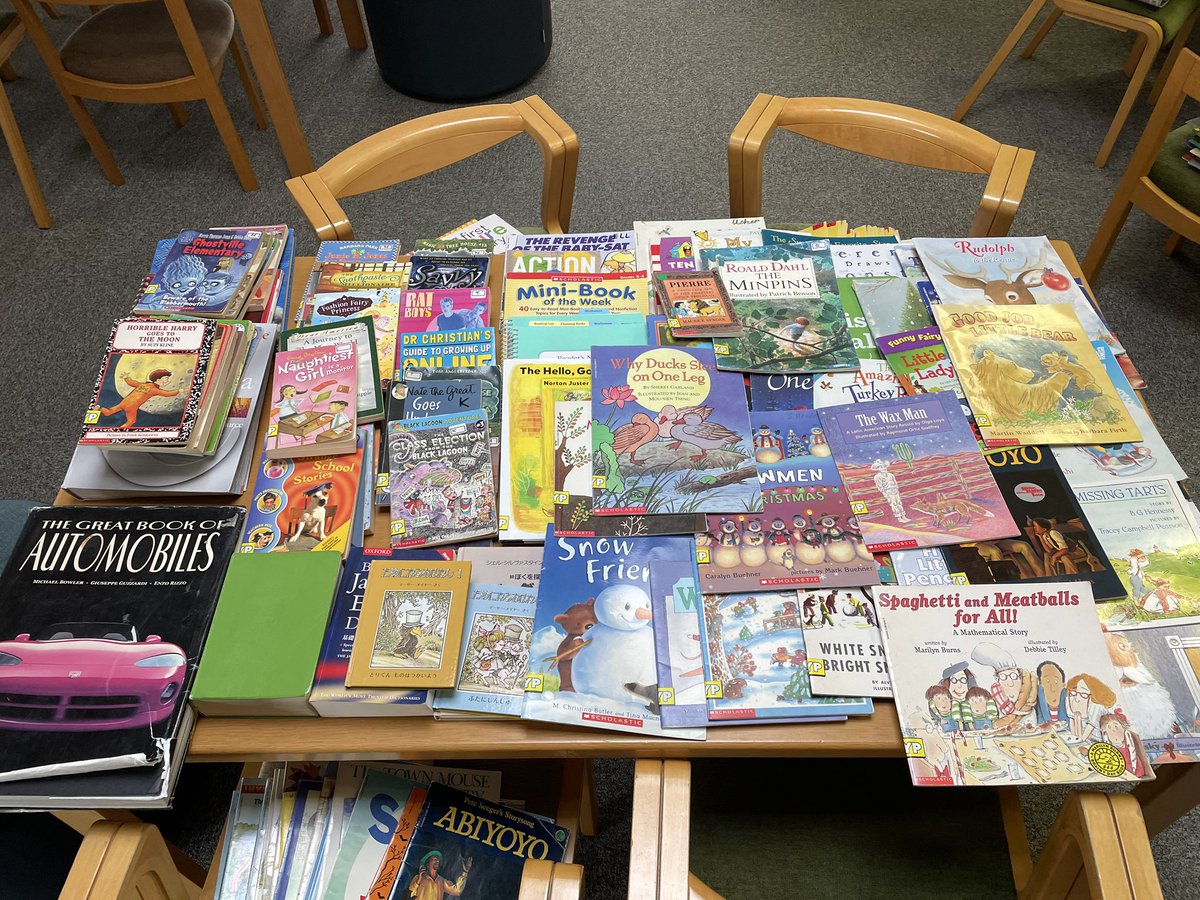 LibraryKirkL's tweet photo. So fun watching ES teachers “book shop” the hundreds of books I found just sitting in boxes unused. Hooray for putting books in the hands of our students! #FISlearns #FISreads #intlchat #read @FISSharks https://t.co/mW71pVsCVS