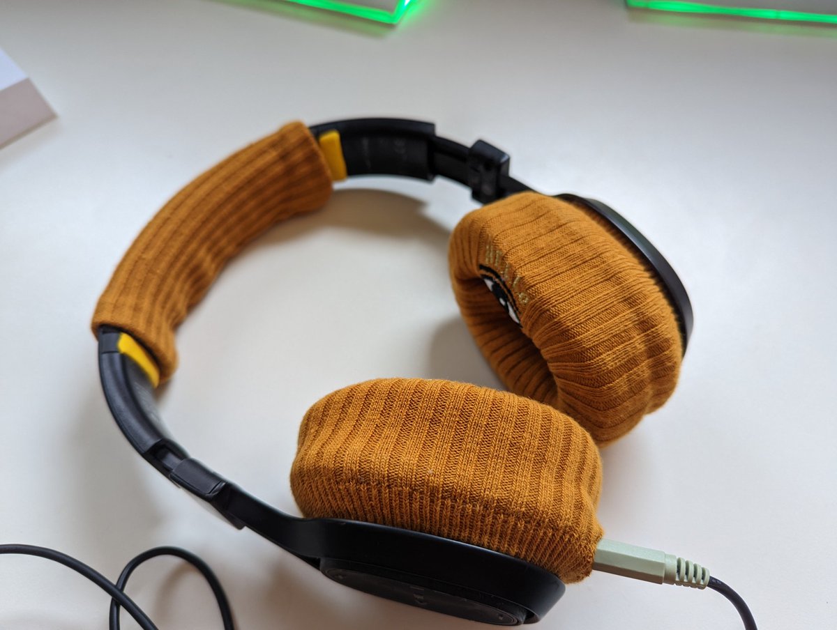 Replaced the flaking faux leather on an old set of headphones with a pair of socks. They still work great and it was an easy fix.