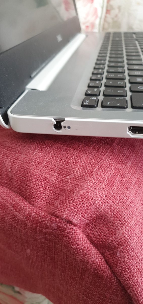 Help! My <a href="/Dell/">Dell</a> Inspiron 1500 has a charging issue, (possibly linked to the damage in the photo 🙈) Do I try to get it repaired, or replace? I kind of need it ASAP, but funds are limited.