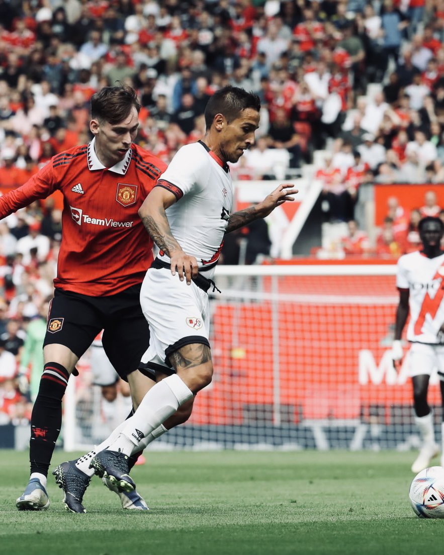 James Garner puts pressure on a Rayo Vallecano player.