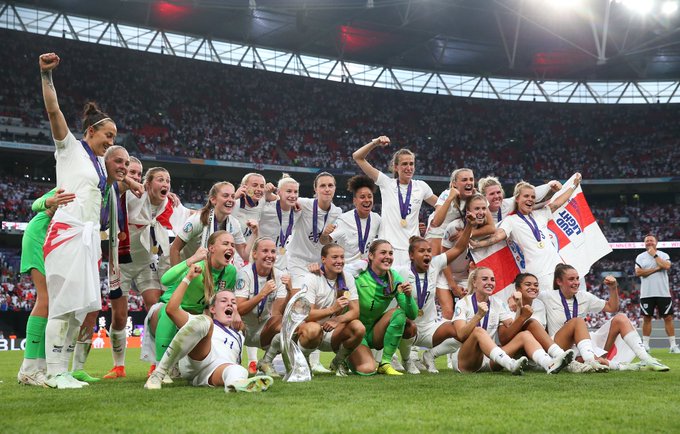 England celebrate on the pitch after winning the Euros