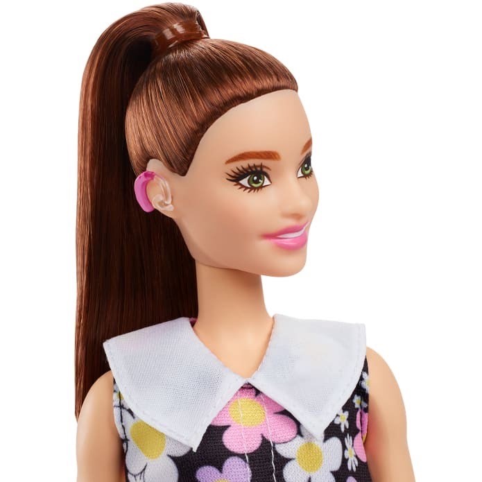 skiptonaudio's tweet image. It's #PlayDay today and representation matters for young children as well as adults. Look at 
Barbie Fashionista doll with her new pink hearing aids.   it’s just a big brand saying look at this doll, her cute dress and shiny hair come with pretty pink hearing aids, and I love it.