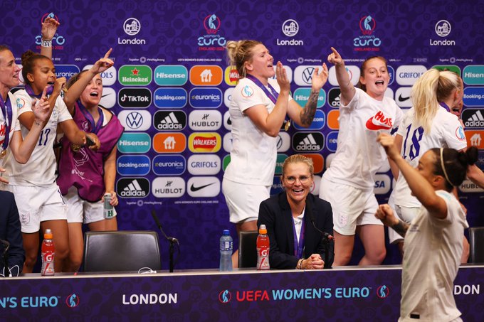 England's players celebrate in the press conference room