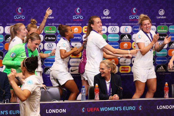 England's players celebrate in the press conference room