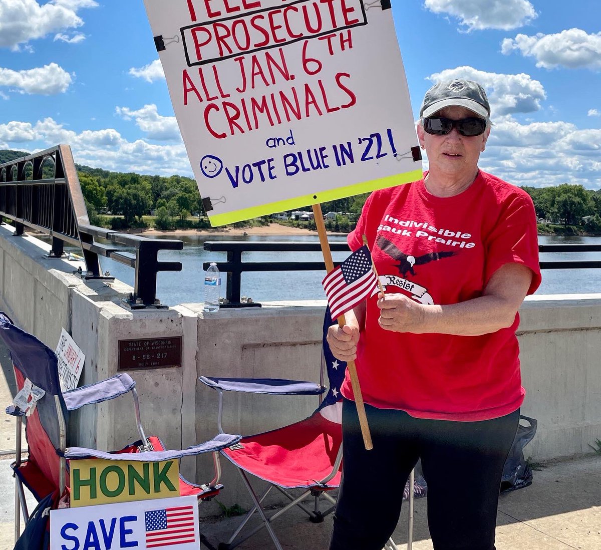 IndivisSP's tweet photo. ISP’s Save Democracy Bridge Rally today. Trump&amp;MAGA Repubs engaged in criminal conspiracy. Support the January 6th Committee in holding to account everyone involved in this crime. Let’s get active. Failure is not an option!
#savedemocracy @indivisibleteam #january6th #saukprairie https://t.co/3ppvcJQDHV