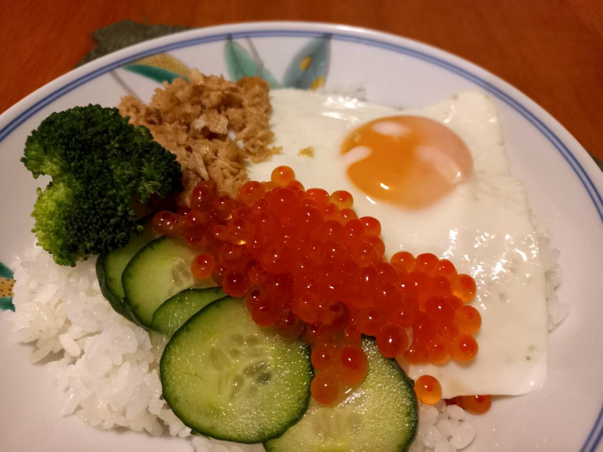 Japanese cuisine. Caviar, salmon and egg rice bowl.