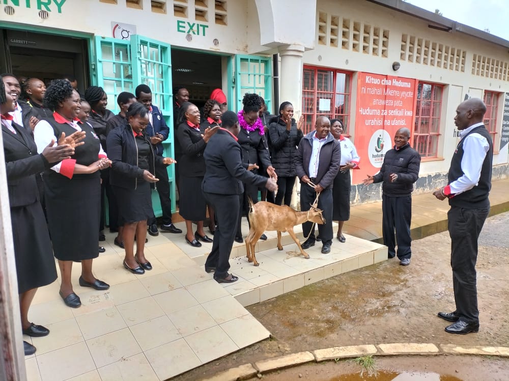 HudumaKenya's tweet photo. Baringo Huduma Centre staff today celebrating their Centre Manager by gifting him a goat as a token of appreciation. #RecognizingInternalCustomers. https://t.co/vFYSE2W6NU