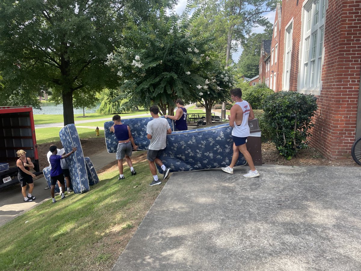 CoachTommyAtha's tweet photo. A little lunch time community service in the middle of two-a-days! The Tigers pitching in to get new mattresses in the dorms. #PurplePride #TigerStrong ⁦@DarlingtonTiger��� https://t.co/LblagAWmcF