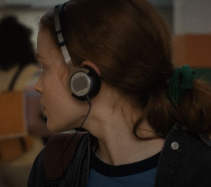 her and her headphones.