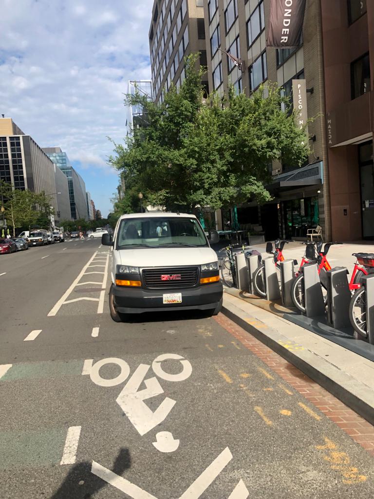 Hjuer's tweet photo. @311DCgov 1819 L St NW White GMC Maryland license plate #1DT0718 parked in the bike lane. Grateful if you could raise a ticket. https://t.co/gkyUdHG2qr