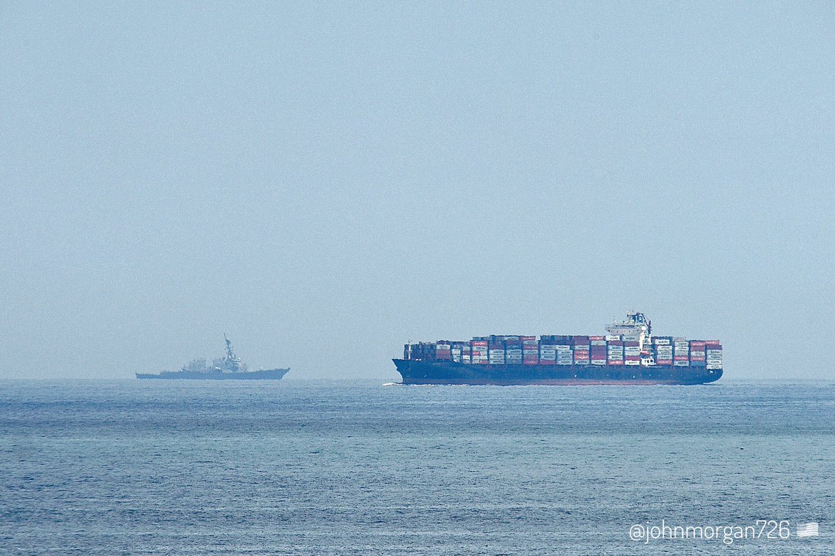 The #ContainerShip #Xiamen IMO:9318151 en route to Norfolk, Virginia, flying the flag of Liberia 🇱🇷. And in the background the #USSLaboon #DDG58 🇺🇸 Arleigh Burke-class Flight I guided missile destroyer doing continuous turns to starboard. #ShipsInPics