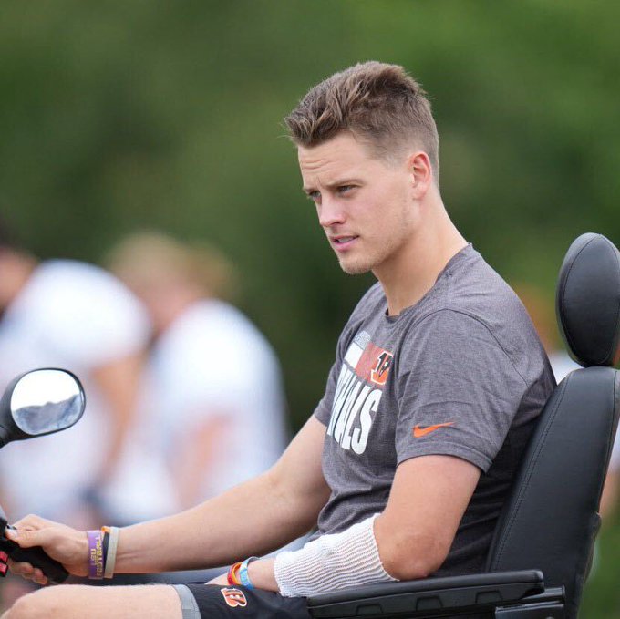 Joe Burrow on a scooter at Training Camp.