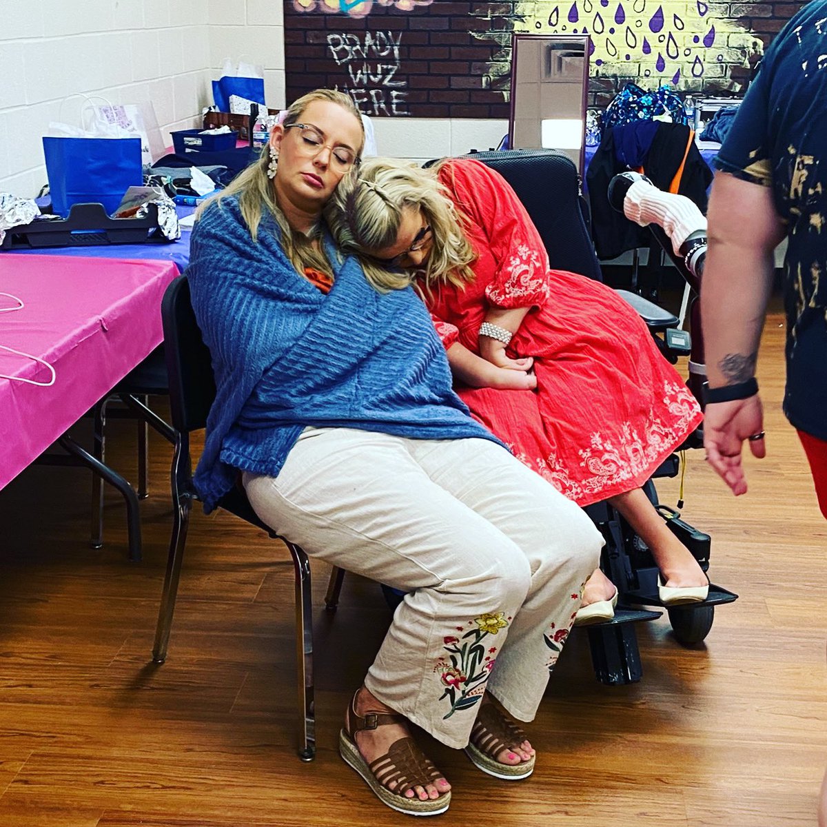MsWheelchairUSA's tweet photo. Pageant week is long and hard. Here @Sara_Gaver, Ms. Wheelchair Florida USA and winner of #MsWheelchairUSA 2022, and her best friend and caregiver, Angelina, take a nap before the Friday Night on stage competition. #MWUSA #DisabilityPride #DisabilityPageant https://t.co/q6fVFkMlF5