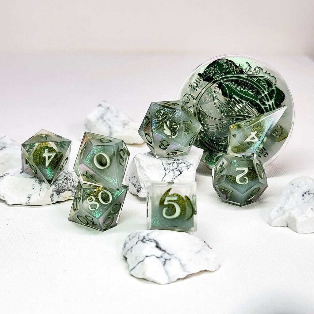 𝐓𝐚𝐬𝐭𝐞 𝐨𝐟 𝐀𝐛𝐬𝐢𝐧𝐭𝐡𝐞
Inspired by the classic way to indulge in Absinthe. Ice cold water slowly drips from a fountain, dissolving a sugar cube through a slotted spoon. It turns the green to an opalescent white that seems to shimmer in the light.
#dice #dnd #handmade