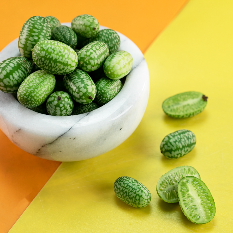SpecialtyProd's tweet photo. What do you call this adorable fruit? #specialtyproduce #cucomelon #watermelongherkin