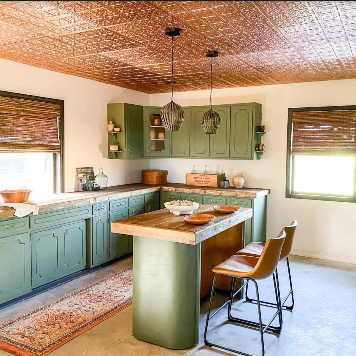 ceilume's tweet photo. This absolutely gorgeous space by Amy at @maisondemings with its copper Fleur-de-lis ceiling tiles by Ceilume, green cabinets, wood countertops, and beautiful details is so warm and welcoming. #ceilingtiles #copper #coppertiles #mediterranean #homedecor #dropceiling #interiordes https://t.co/SjZPX1vDWE