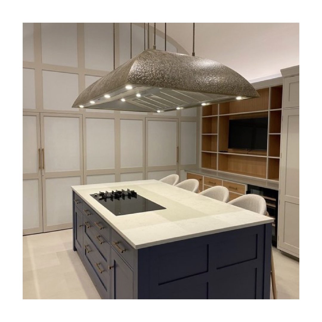 A real statement bespoke recirculating island hood finished in textured antique brass