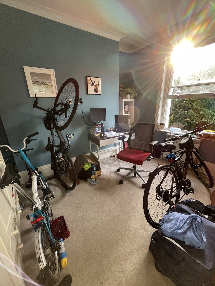 MissBehavioural's tweet photo. My home office set up yesterday got a bit busy. Can we start of a thread of other @WeAreCyclingUK colleagues or other #cyclingindustry worker’s home offices? 😀 #cycling #homeoffice #cyclinglife https://t.co/yfNQyqnS8M