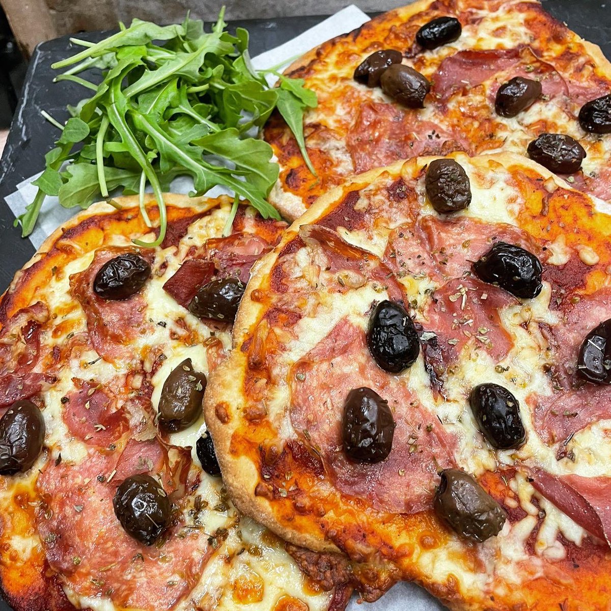 Pizza!  Freshly made garlic and yoghurt flatbreads, topped with tomato passata, cheddar cheese, olives and salami.  Get them while they’re hot.

#independentclevedon #clevedon #hillroadclevedon #pullinsbakery #artisanpizza #flatbreads