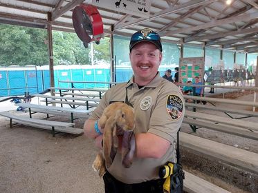 SCCMOPD's tweet image. Fun fact - Officer Peter Colombini loves animals. This picture was taken when he was patrolling the St. Charles County Fair. #SCCPDCommunity