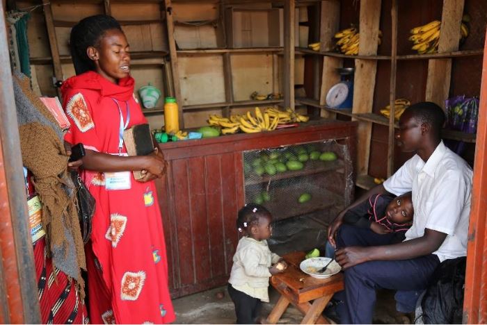 AEAustralia's tweet photo. A missioner prays for a shop attendant during door-to-door evangelism. Uganda Mission Story. #AEonMission https://t.co/EZobftF8pJ