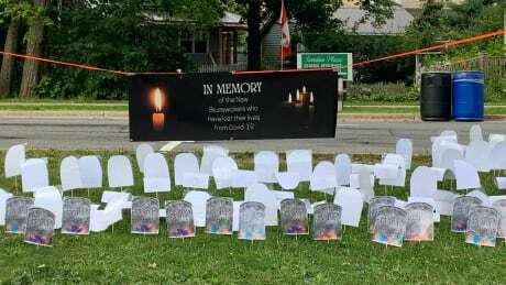 CBCNB's tweet photo. Volunteers set up sombre reminder of N.B.'s COVID-19 death toll: https://t.co/wc1DrxZT42 https://t.co/8GZxPwRGso