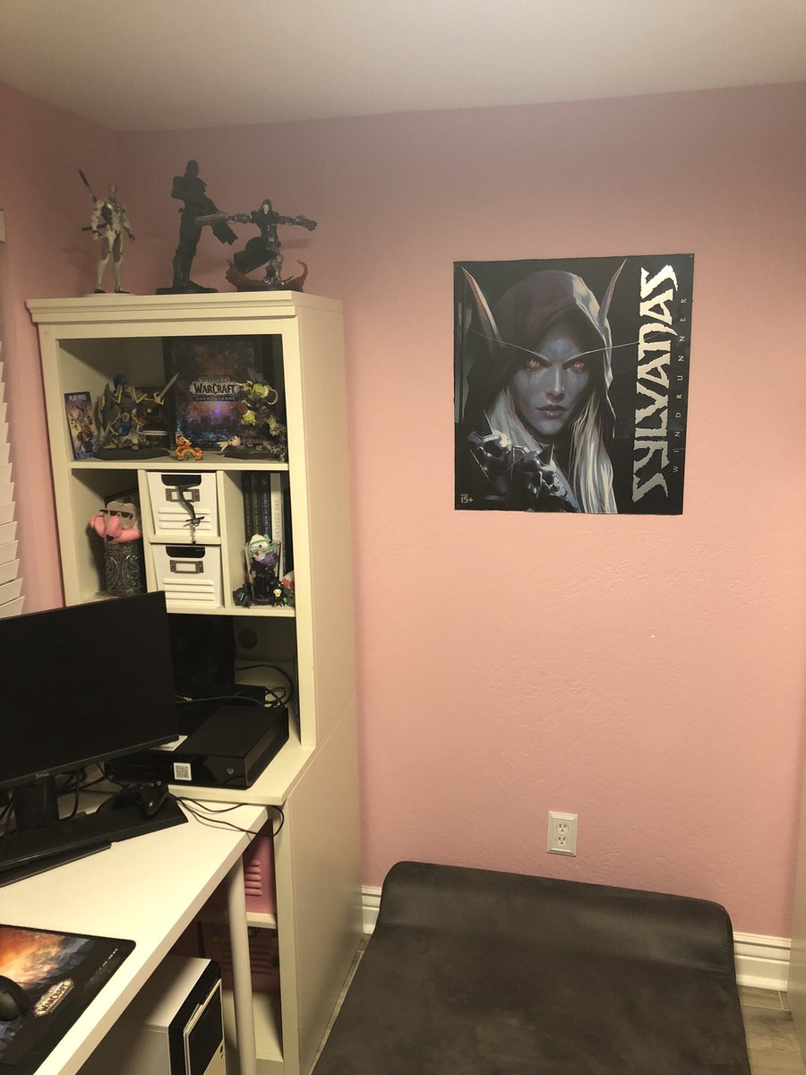 travis_foo's tweet photo. @Leah_Augustine Apologies for the mess but here’s what I have set up. Mostly decorated with Blizz merch I’ve acquired from working with them for  a few years. Then there’s some pops and other miscellaneous art. And a puppy :) https://t.co/CqPcwQCuTq