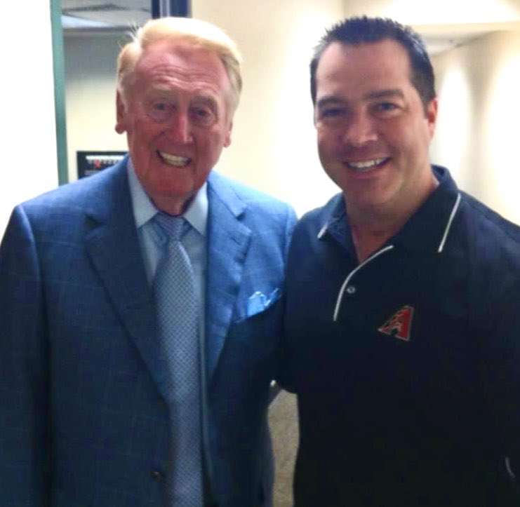 AZDvoice's tweet photo. 1st yr announcing for  @Dbacks I introduced myself to @Dodgers @TheVinScully and he took the time to chat. Next day I pass him in the hall and he said “Chuck, you sounded great”. 17 yrs later, still the greatest memory I have in my baseball career. He remembered my name! #RIPVin https://t.co/BKRpiu0aeM
