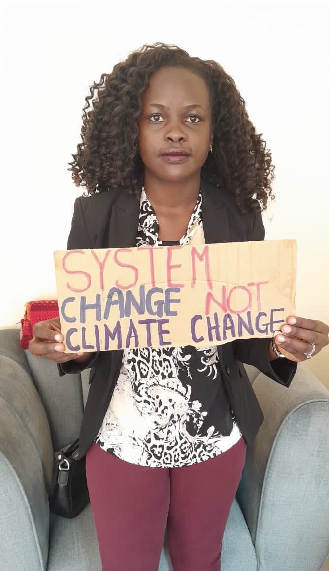 eve_chantel's tweet photo. We Demand System Change 
Not Climate change https://t.co/K2pVlGjM5M
