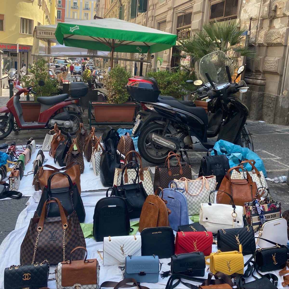 Our team came across #counterfeit luxury being sold in plain sight on the streets of Naples, Italy last week. Even the home of Bottega Veneta, Gucci, and Prada are not immune to Canal Street quality fakes...
